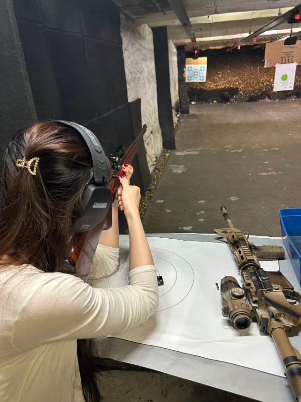 Student shooting rifle at range